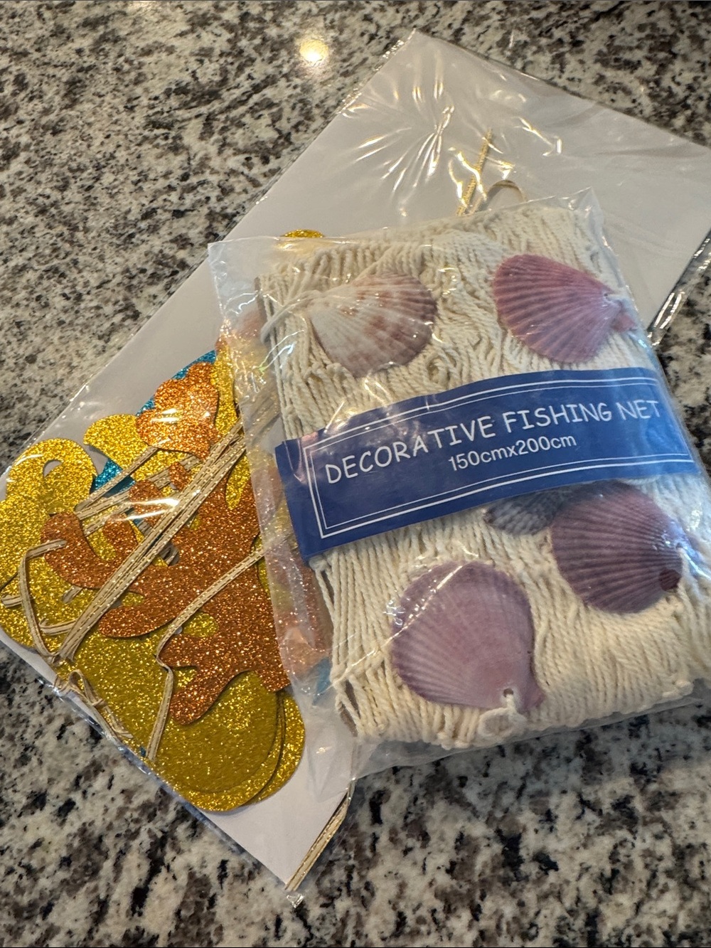 Bridal shower, two less fish in the sea themed banner and decorative fishnet